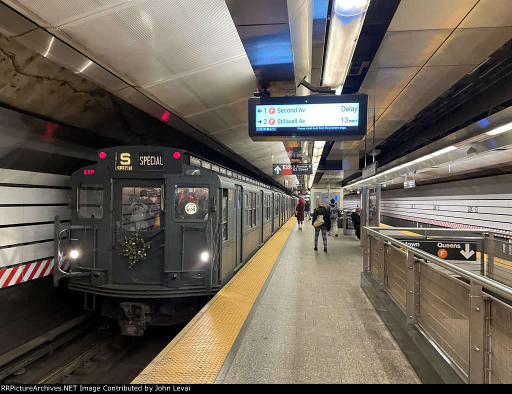 Southbound Holiday Train about to depart Lexington Av-63 St Station 